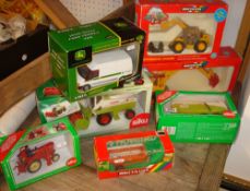 Collection of various Britain`s die cast 1/32 scale models of farm machinery, including Siku