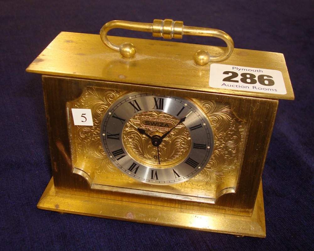 Swiza 8 day brass cased Swiss clock with alarm mechanism, raised chapter ring, black Roman