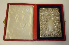Silver card case with ornate scrollwork embossed decoration in original fitted red leathered case