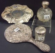 Silver dressing table mirror with pretty floral embossed decoration, perfume bottle, toilet jar