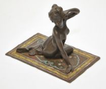 After Bergman bronze group of a nude female on a decorative Middle Eastern rug, signed `Nam Greb`,