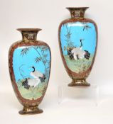 Pair of Japanese Meiji period cloisonné vases decorated with panels of exotic birds and flowers,