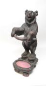 A Black Forest carved resin Bear Umbrella Stand, 77cm tall