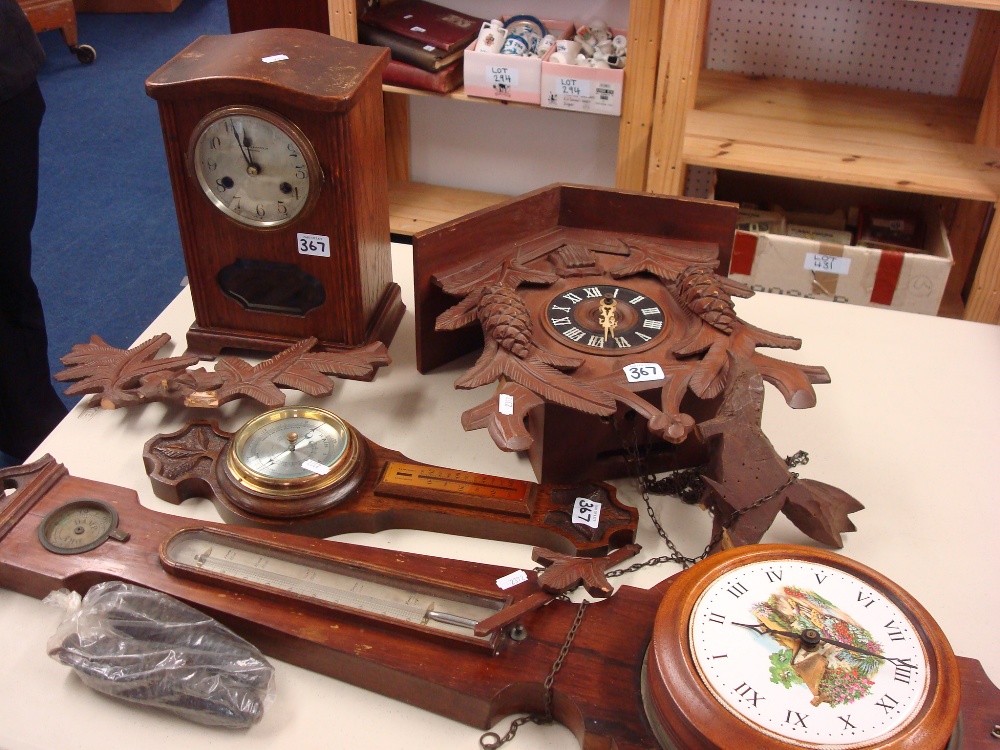 A Cuckoo clock, oak cased mantle clock, 19th century rosewood barometer for restoration another