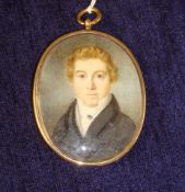A 19th century miniature and locket, in oval gilt metal frame, with painting of a gentleman, a