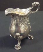 Ornate silver cream jug by Carrington & Co, London, approximately 6.2oz, 10cm high