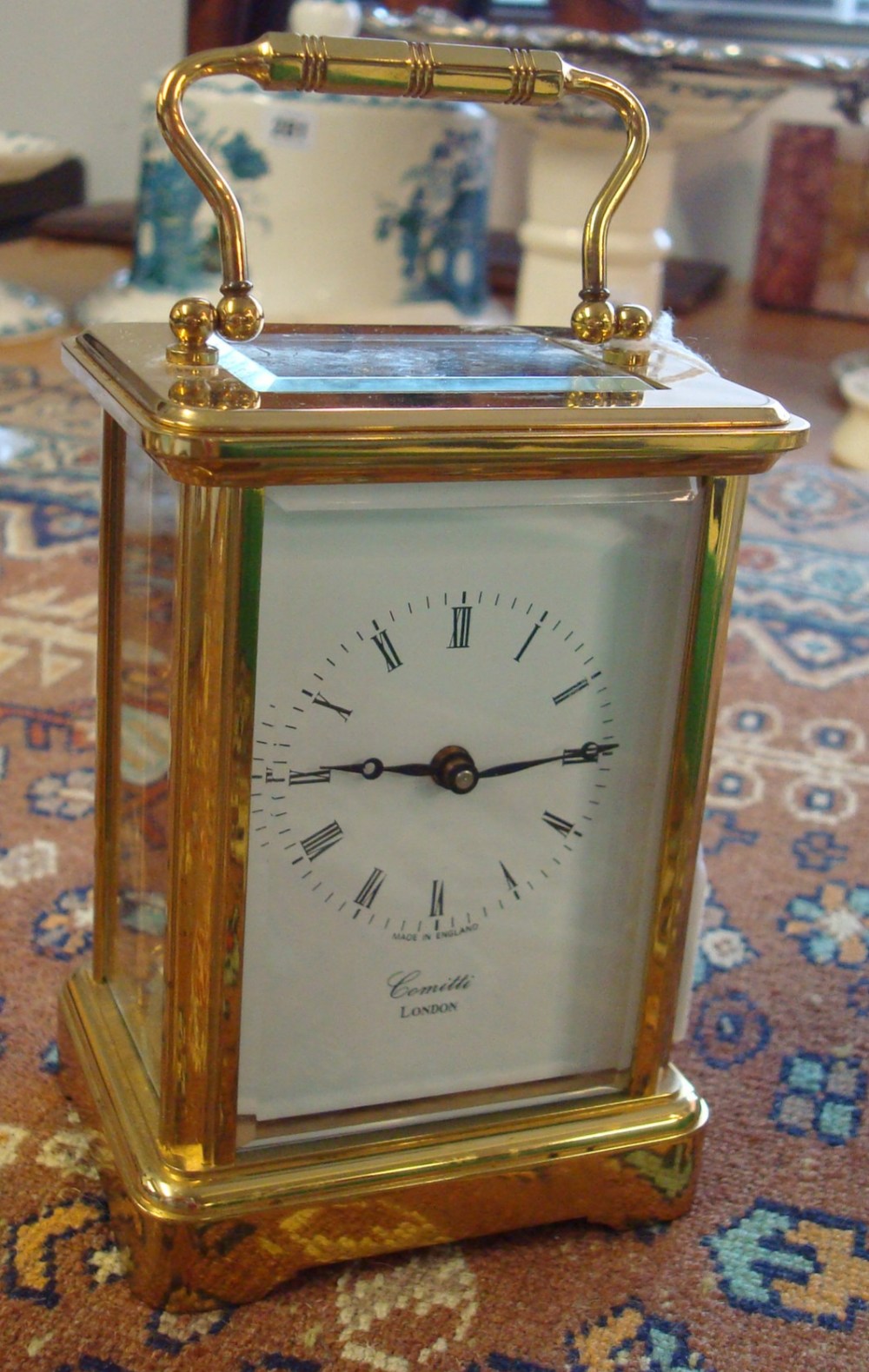 Modern Comitti carriage clock with platform escapement and key