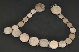 Coin belt including various Georgian and Victorian and later coins, 60cm long