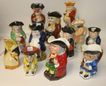 Collection of twelve 19th century pottery Toby Jugs, most with tricorn hats