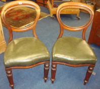 Set of six Victorian mahogany framed balloon back dining chairs with overstuffed seats, fluted legs