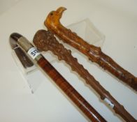 Various wood carvings, sundry tea wares, three walking canes including novelty walnut cane with