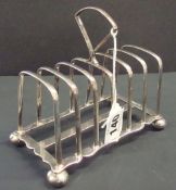 A silver six division toast rack, approximately 7.73oz