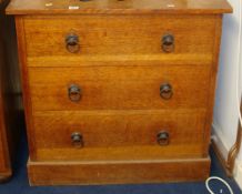 Small oak chest fitted with three long drawers t/w an old cylindrical box with iron handles and a