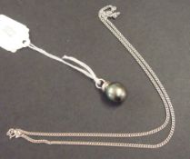 Modern black South Sea pearl on 18ct white gold and diamond pendant, together with a 9ct white