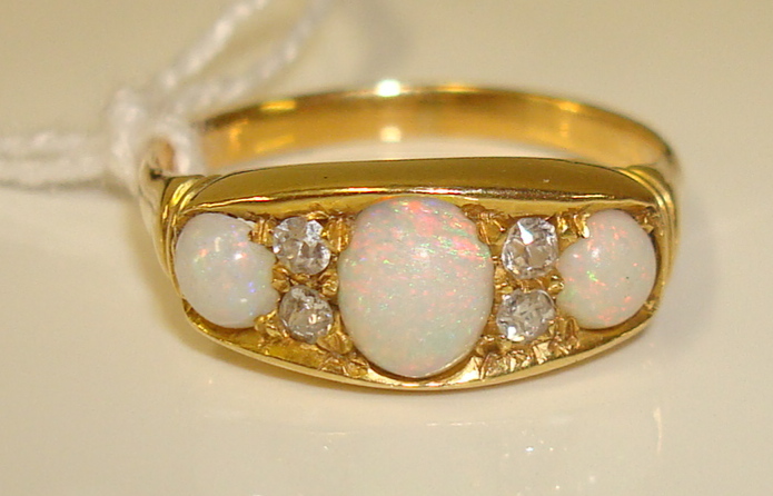 Antique yellow gold opal and diamond half hoop ring, 18ct set with three oval opals approximately