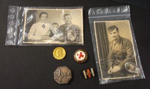 Collection of World War Two German badges and various photographs