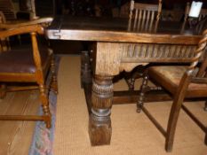 A large oak Tudor Style Refectory Dining Table, approximately 3.2 metres long and 1.06 metres