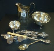 Various silver objects including cream jug, cutlery, small sugar bowl, table salt etc