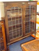 1920s/30s oak two door leaded light bookcase, 113cm wide