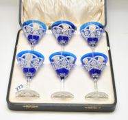 Six 20th century cut glass wine glasses in blue and clear in original fitted box, 12 cm high