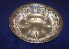 A Geo V silver and pierced circular bowl, London, approx 10.20 oz
