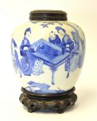 A Chinese blue and white ginger jar with carved wood stand and cover, 20cm high