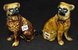 Pair of 19th century pottery pug dogs, approx 21cm high