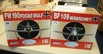 Two metal scale model aeroplanes including FW190 and BF109, boxed
