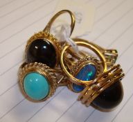 Six 9ct rings including opal and Tigers Eye also one yellow metal ring approximately 23g