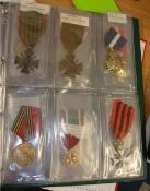 An album of American replica military badges (approx 16)