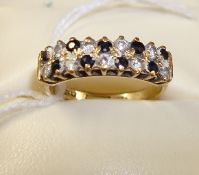 A sapphire and diamond cluster ring set in 9ct gold, size, J