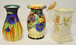 Three art pottery jugs including Wintertons, the tallest 26cm