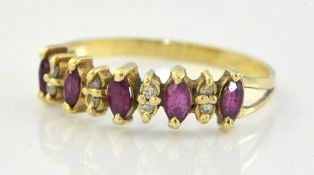 A five stone ruby and diamond set ring mounted in yellow gold, size P