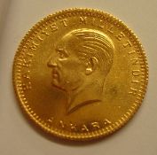 A Turkish gold coin bears a date 1923 (Ankara)
