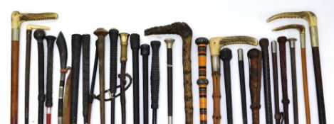 Collection of various vintage riding crops, approx 26