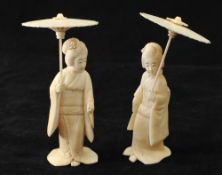 Two similar carved Japanese ivory figures of ladies with parasols (the tallest 8cm)