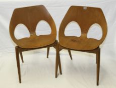 A pair of Jason chairs designed by Carl Jacobs for Kandya, each with Kandya paper label