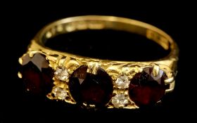 Antique 18ct three stone garnet and diamond set ring, size P