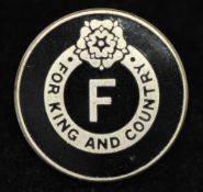 A British Union of Fascists membership badge, black enamel with a central F, `For King and