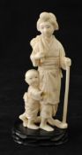 Carved Japanese ivory figure Mother and Child, 12cm with stand