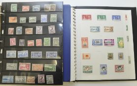 Collection of Newfoundland and Ceylon stamps in two albums