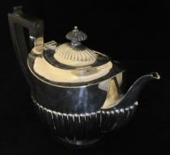 Silver Bachelors tea pot oval gadroon decoration to lower body and lid with cherry wood handle and