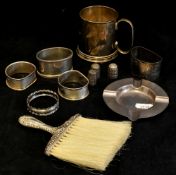 Various silverwares including napkin rings, christening mug, thimbles, ashtray and silver back table
