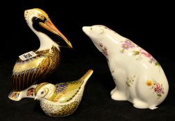 Three Royal Crown Derby paperweights including brown pelican, small bird and polar bear (3)