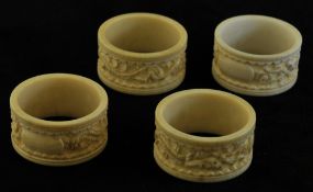 Group of four carved ivory napkin rings