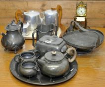 Various pewter ware including Arts and Crafts and Piquet ware tea set t/w a brass anniversary clock,