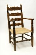 An antique carved and joined oak elbowed chair with ladder back and new rush seat