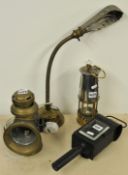 Early brass desk lamp, two coach lamps and a miners lamp