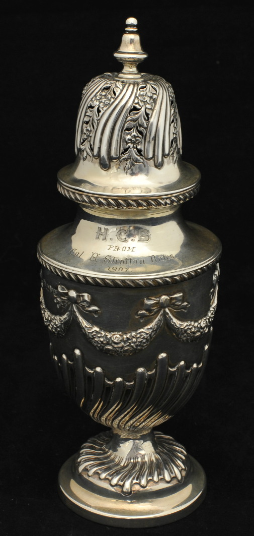 Edwardian silver sugar castor decorated with swags and half fluted body, with inscription `From