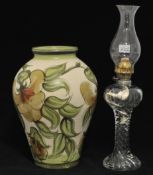A large Langley art pottery vase also an all glass oil lamp 44cm